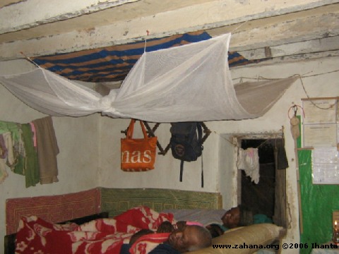 Using the mosquito net in the house_in_Fiadanana_Madagascar
