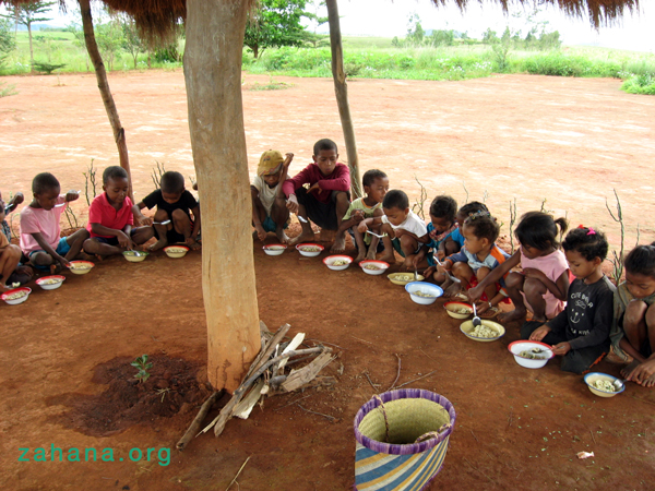 Using the school pavilion as the lunch room (staying outside is great after all the rain)  - zahana.org