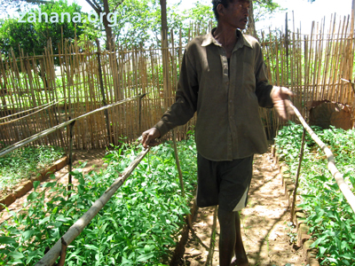 Fiarenana's gardener with his new seedlings in Madagacar. Zahana.org