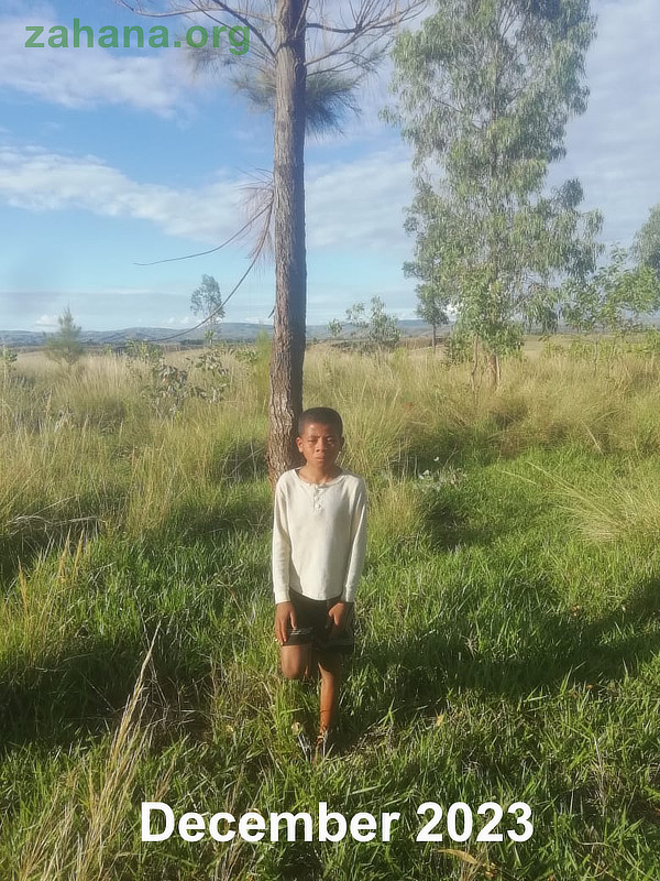 Little boy Planting a tree in Madagascar Reforstation