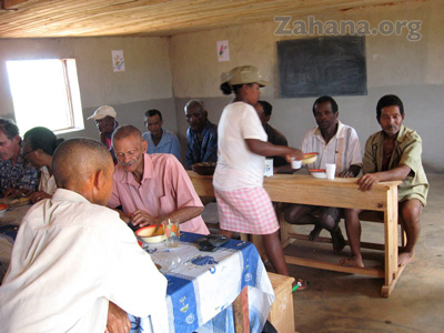 celebrating the inauguration of their school in Fiarenana, Madagascar with food– Zahana.org 