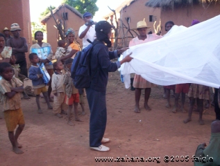 Demonstrating mosquito net use